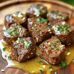 - 1 pound sirloin steak, cut into 1-inch cubes - 4 tablespoons unsalted butter - 4 cloves garlic, minced - 2 tablespoons fresh parsley, chopped - Optional: crushed red pepper flakes The main stars of this dish are the sirloin steak and garlic. Sirloin is tender and has a rich flavor. I cut it into 1-inch cubes for quick cooking. The butter adds a creamy texture and a nice shine. Garlic brings a bold taste that really pops. You can add crushed red pepper flakes for a little heat. - Salt and pepper to taste - 1 teaspoon smoked paprika - 1 teaspoon lemon juice I use salt and pepper to boost the meat's natural taste. Smoked paprika adds a hint of smokiness that makes each bite special. A splash of lemon juice brightens the dish and balances the richness of the butter. - Options for side dishes - Suggestions for garnishes For side dishes, think about serving garlic butter steak bites with mashed potatoes or fresh veggies. They pair well with a green salad, too. Fresh herbs like more parsley or chives make great garnishes. You could also sprinkle some cheese on top for a tasty twist. For the full recipe, check out the complete instructions and enjoy a juicy and flavorful delight! Seasoning the steak cubes Start by cutting 1 pound of sirloin steak into 1-inch cubes. Place the cubes in a bowl. Season them with salt, pepper, and 1 teaspoon of smoked paprika. Mix well to coat each piece evenly. This adds great flavor. Preparing the skillet Grab a large skillet and set it on the stove. Turn the heat to medium-high. Add 2 tablespoons of unsalted butter. Let it melt and bubble. This will create a perfect base for searing the steak. Searing the steak bites Once the butter is hot, add the seasoned steak cubes in a single layer. Don’t overcrowd the skillet. Sear them for about 2-3 minutes until they are browned on one side. This gives a nice crust. Cooking to desired doneness Flip the steak bites using tongs. Cook for another 2-3 minutes. Check for doneness; medium-rare is best. Remove the steak from the skillet and set it aside on a plate. Making the garlic butter sauce In the same skillet, lower the heat to low. Add the remaining 2 tablespoons of butter and 4 minced garlic cloves. Sauté for 1-2 minutes until the garlic is fragrant but not burnt. This sauce is key to flavor. Combining steak with garlic butter Return the steak bites to the skillet. Drizzle with 1 teaspoon of lemon juice. Sprinkle with 2 tablespoons of chopped parsley. Toss to coat everything in the garlic butter sauce. If you like heat, add crushed red pepper flakes. Now, serve your garlic butter steak bites warm. Enjoy this juicy and flavorful delight! For the full recipe, check out the recipe section. To get that nice crust, you need a hot skillet. Use a heavy skillet, like cast iron. Heat it on medium-high for a few minutes. When you add butter, it should sizzle. This means your pan is ready. When you cook the steak, don’t crowd the pan. This keeps the heat high. Sear the steak for about 2-3 minutes on one side. Flip it once, then cook for another 2-3 minutes. For best taste, aim for medium-rare. To boost the taste, think about adding spices. Besides salt and pepper, try onion powder or thyme. Fresh ingredients matter too. Fresh parsley brightens the dish. Always choose fresh garlic for the best flavor. If you want a kick, add crushed red pepper flakes. They give a nice heat without overpowering the steak. A bit of lemon juice adds zing, too. For plating, keep it simple but nice. Use a clean white plate to show off the steak bites. Add a sprinkle of fresh parsley on top. This adds color and freshness. Pair these bites with sides like mashed potatoes or a fresh salad. These sides balance the rich flavors of the steak. Check out the Full Recipe for more ideas on sides. {{image_2}} You can switch up the meat for garlic butter steak bites. Use chicken or shrimp instead of steak. Chicken cooks quick and stays juicy. Cut it into small pieces and follow the same cooking steps. Shrimp is also a great choice. It cooks fast and soaks up the garlic butter well. Just be careful not to overcook it. For a vegetarian option, try using portobello mushrooms. They have a meaty texture and can absorb the garlic butter flavor nicely. Want to take your garlic butter steak bites to the next level? Add some sauces or marinades. A splash of soy sauce gives a nice umami flavor. You can also try teriyaki sauce for a sweet twist. Fresh herbs brighten the dish. Try adding thyme or rosemary along with the parsley. These herbs bring a fresh taste that pairs well with garlic. Think about what to serve with your garlic butter steak bites. A side of roasted vegetables works great. You can also serve them with rice or mashed potatoes. They soak up the garlic butter perfectly. If you have leftovers, make a tasty snack. Toss the steak bites into a salad or wrap them in a tortilla. You can create a fun meal with whatever you have left! For the full recipe, check out the section above. Enjoy your cooking! To keep garlic butter steak bites fresh, store them in the fridge. Place them in an airtight container. This helps to keep out moisture and air. - Refrigeration guidelines: Store in the fridge for up to three days. - Container recommendations: Use glass or plastic containers with tight lids. When it’s time to enjoy leftovers, you want them to taste great. Reheat steak bites gently. - Best practices for reheating without losing flavor: Warm them slowly over low heat. This keeps the meat juicy. - Microwave vs. skillet reheating: The skillet works better. It helps to maintain the texture and flavor. If you want to save some for later, freezing is a good option. - Tips for freezing garlic butter steak bites: Let them cool completely before freezing. Place them in a freezer-safe bag. Remove as much air as possible. - Thawing and reheating instructions: Thaw overnight in the fridge. Reheat in a skillet for best results. To make garlic butter steak bites spicy, add crushed red pepper flakes. You can sprinkle them on the steak bites while they cook. This adds heat and flavor. Start with a small amount. You can always add more if you like it hotter! Yes, you can use a different cut of steak. Good alternatives include ribeye or filet mignon. These cuts are tender and flavorful. Just remember that cooking times may change based on the cut. Always adjust your cooking time to get the best results. To check if the steak bites are done, use a meat thermometer. Aim for 130°F for medium-rare and 140°F for medium. If you don’t have a thermometer, you can also check by cutting one open. The center should be pink for medium-rare. Always let the steak rest for a few minutes before serving. This keeps it juicy. For the full recipe, refer to the previous sections! This blog post showed you how to make garlic butter steak bites. You learned about the key ingredients, simple steps for cooking, and storage tips. We shared variations to customize your dish and answered common questions. Enjoy experimenting with different meats and spices. You can create something special every time. With these tips, you'll impress anyone who tries your steak bites. Cooking can be fun and easy, and you now have the knowledge to make a great meal.