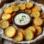 - 1 jar dill pickles (slices or spears) - 1 cup all-purpose flour - 1 cup buttermilk (or milk with 1 tablespoon vinegar added) - 1 cup breadcrumbs (preferably panko for extra crispiness) - 1 teaspoon garlic powder - 1 teaspoon onion powder - 1 teaspoon smoked paprika - 1/2 teaspoon cayenne pepper (adjust to your spice preference) - Salt and pepper to taste - Oil for frying (such as vegetable or canola oil) To make crispy fried pickles, you need simple ingredients. The main star is dill pickles. You can use slices or spears, depending on your taste. The breading is key for crunch. You need flour, buttermilk, and breadcrumbs. The buttermilk helps the breading stick. For the best crunch, use panko breadcrumbs. They make the pickles extra crispy. Seasonings add flavor. Garlic powder, onion powder, and smoked paprika give a nice taste. If you like spice, add cayenne pepper. Finally, don’t forget salt and pepper to bring it all together. You can find the full recipe at [Full Recipe]. To start, you need to drain and dry the pickles. Open the jar and pour out the juice. Then, place the pickles on a paper towel. Pat them dry to remove moisture. This step helps make them crispy. Next, you will begin the dredging process. In a shallow dish, mix flour, garlic powder, onion powder, smoked paprika, cayenne pepper, salt, and pepper. This mixture gives flavor to the pickles. In another dish, pour buttermilk. The buttermilk helps the coating stick. Have a third dish ready with breadcrumbs. Panko works best for that extra crunch. Now, it’s time to fry! Preheat oil in a deep frying pan over medium-high heat. You want the oil to reach 350°F (175°C). This is the perfect temperature for frying. Once the oil is hot, take each pickle slice. First, dredge it in the seasoned flour. Make sure each piece is coated well. Then, dip the floured pickle into the buttermilk, letting the excess drip off. Finally, roll the pickle in the breadcrumbs. Press lightly to help them stick. Carefully place the coated pickles in the hot oil. Fry them in batches to avoid overcrowding. Fry until golden brown and crispy, which takes about 2-3 minutes per side. Once done, remove them with a slotted spoon. Place them on a paper towel-lined plate to soak up extra oil. Now for the fun part: serving! Present your crispy fried pickles on a large platter. Line the platter with parchment paper for a rustic touch. Place a small bowl of dipping sauce in the center for easy access. For dipping sauces, ranch dressing is a classic choice. If you want some heat, try spicy remoulade. You can add a sprinkle of fresh herbs, like parsley, for a colorful finish. Enjoy your crispy fried pickles fresh and warm! For the full recipe, click here. To get that perfect crunch, start by removing moisture from the pickles. Wet pickles won’t fry well. Use paper towels to pat them dry. This step is key for a crispy coating. Next, I recommend using panko breadcrumbs. They are coarser than regular breadcrumbs. This texture gives your pickles that extra crunch you crave. When you roll the pickles in panko, press lightly to help them stick. One common mistake is overcrowding the frying pan. When you fry too many pickles at once, the temperature of the oil drops. This makes them greasy and soggy. Fry in small batches to keep the oil hot. Another mistake is not seasoning adequately. Always season your flour mix well. It adds flavor to the pickles. Taste your flour mix before using it. Adjust the spices to fit your taste. Proper seasoning makes a big difference in flavor. {{image_2}} You can easily change the taste of your crispy fried pickles. Adding different spices or herbs can make a big difference. Here are some ideas: - Spices: Try adding cumin, chili powder, or Italian herbs. These spices can make the pickles more exciting. - Herbs: Fresh dill or parsley can add a fresh twist. Mixing in herbs can enhance the flavor. If you want a vegan option, you can replace buttermilk. Use plant-based milk with a splash of vinegar. This makes it safe for everyone to enjoy. The fun doesn’t stop with just frying; serving styles can also add flair. Here are some dipping suggestions: - Dipping Sauces: Classic ranch is a favorite, but you can try spicy mayo or garlic aioli too. These sauces can add a burst of flavor. - Creative Plating: Use a large platter and arrange your pickles in a circle. Place a small bowl of sauce in the middle. You can even add colorful veggies around the edges for a pop of color. These variations can make your crispy fried pickles a delightful experience. Check out the Full Recipe for more details! To keep your crispy fried pickles fresh, store them right. Place the leftovers in an airtight container. Make sure they cool down first. You can keep them in the fridge for about three days. When you want to eat them again, don’t just microwave them. Microwaving makes them soggy. Instead, reheat them in an oven or air fryer. This will help restore their crunch. Heat them at 375°F (190°C) for about 10 minutes. If you want to save some for later, freezing is a good option. First, let the fried pickles cool completely. Then, arrange them in a single layer on a baking sheet. Freeze them for about an hour. This prevents them from sticking together. Once frozen, place them in a freezer bag or container. They can stay good for up to three months in the freezer. When you’re ready to eat them, take out as many as you want. Thaw them in the fridge overnight. After they thaw, reheat them in the oven at 375°F (190°C) for about 10-15 minutes. This way, they stay crispy and delicious. You can find the full recipe for crispy fried pickles in the earlier sections. If you need a dairy-free option, you can make your own buttermilk. Combine 1 cup of regular milk with 1 tablespoon of vinegar or lemon juice. Let it sit for 5 minutes. This creates a similar tangy flavor. You can also use almond milk or soy milk mixed with vinegar for a dairy-free choice. To reduce grease, start by patting the pickles dry. Moisture makes them absorb more oil. You can also use a paper towel to blot the fried pickles after cooking. Another tip is to ensure your oil is hot enough, around 350°F (175°C). This helps fry them quickly, creating a crispy layer without soaking up too much oil. Yes, you can air fry crispy fried pickles! Preheat your air fryer to 400°F (200°C). Follow the same dredging steps. Place the coated pickles in a single layer in the air fryer basket. Cook for about 10 minutes, turning halfway through. This method uses less oil but still gives you that satisfying crunch. To find the best crispy fried pickles, check local diners and pubs. Look at online reviews for places that specialize in Southern cuisine. Ask friends for recommendations, too. Many restaurants take pride in their fried pickles, so you’re sure to find a delicious option nearby! We covered how to make crispy fried pickles, from ingredients to serving ideas. First, we listed key ingredients and preparation steps. Then, we explored frying techniques and tips for that perfect crunch. We also discussed variations and ways to store leftovers. Remember to avoid common mistakes and try different flavors for fun. Making crispy fried pickles can be easy and rewarding. Enjoy experimenting with this tasty snack!